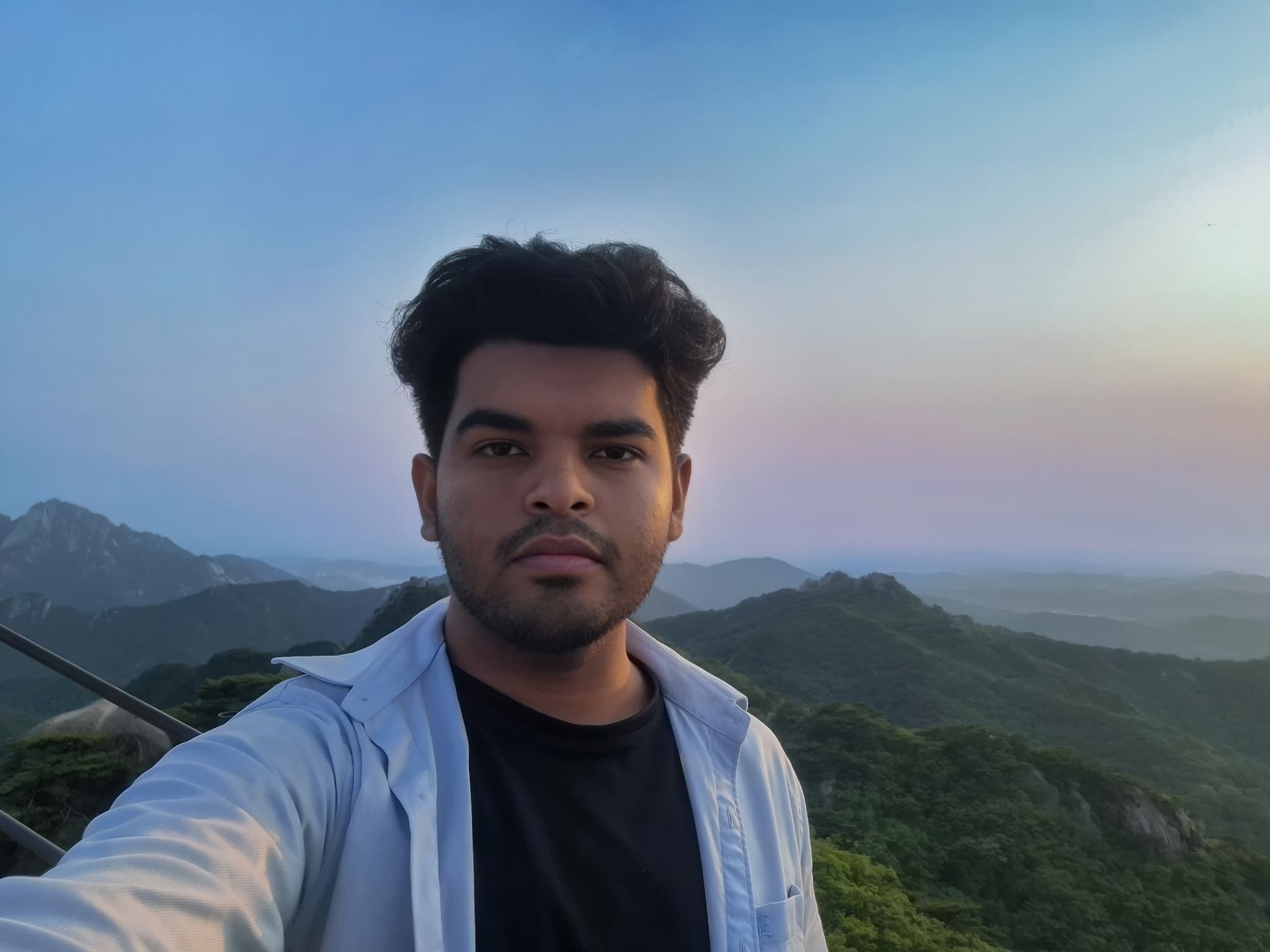 Shawkat Hossain Maruf selfie at Dobongsan Mountain summit during a beautiful summer sunset after a solo hike.